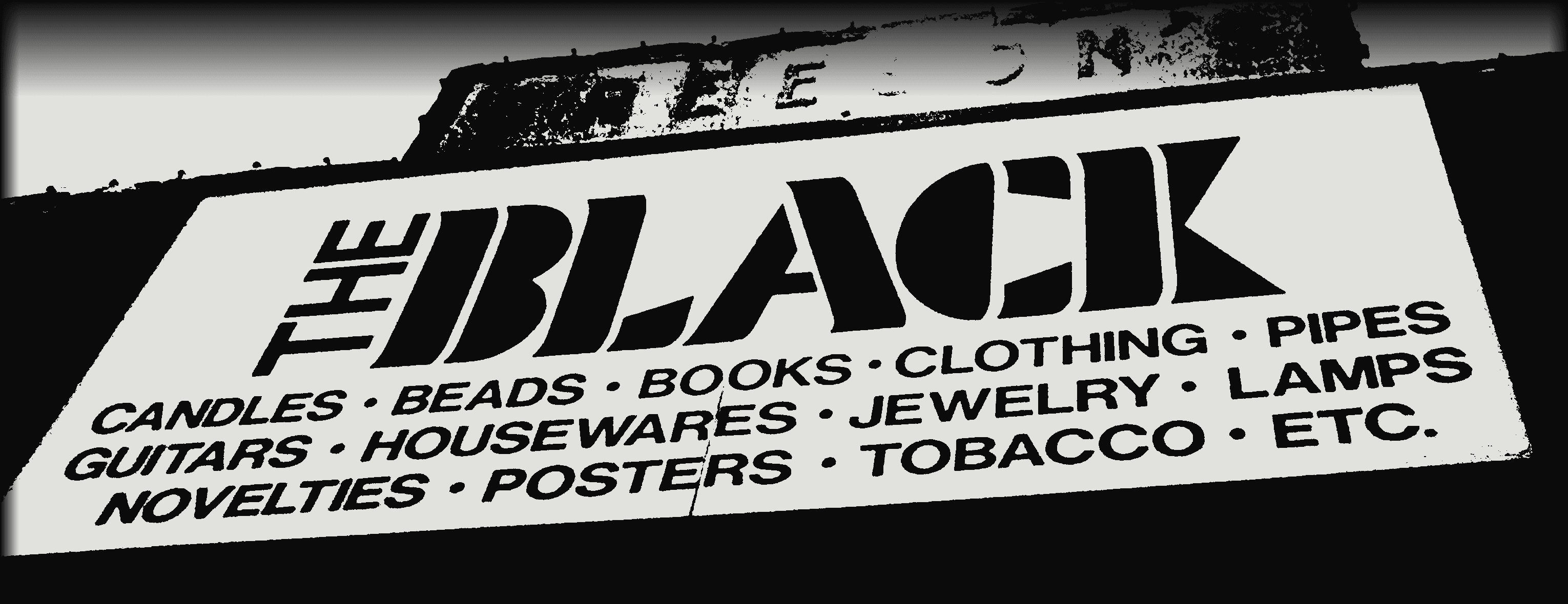 The Black — the Newport Ave storefront sign: candles, beads, books, clothing, pipes, guitars, housewares, jewelry, lamps, novelties, posters, tobacco, etc.